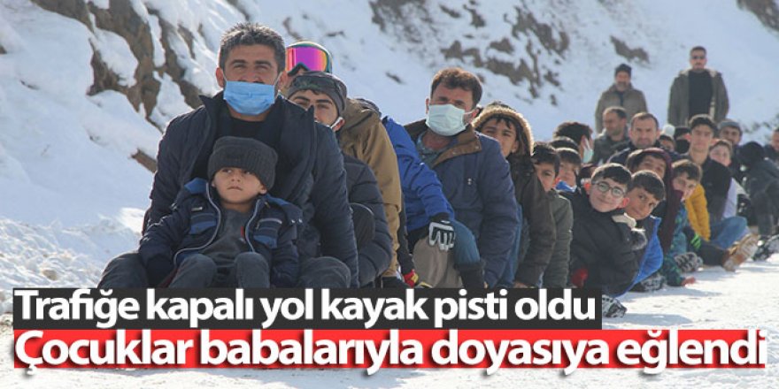 Erzurum'da babalar ve çocuklar beraber kayıyor