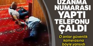 Camide uyuyan şahsın yanına uzanma numarası yapıp telefonunu çaldı
