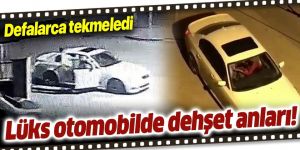 Gözü dönmüş genç, otomobilde kız arkadaşını tekme tokat dövdü
