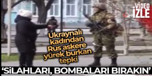 Ukraynalı kadından Rus askere: “Silahları bombaları bırakın”