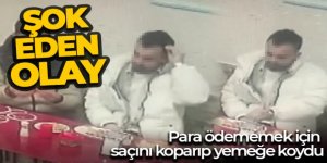 Para ödememek için saçını koparıp yemeğe koydu, o anlar kameralara yansıdı