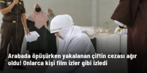 Arabada öpüşürken yakalanan çift, onlarca kişi içinde kırbaçlanarak cezalandırıldı