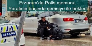Erzurum'da Polis memuru, yaralının başında şemsiye ile bekledi